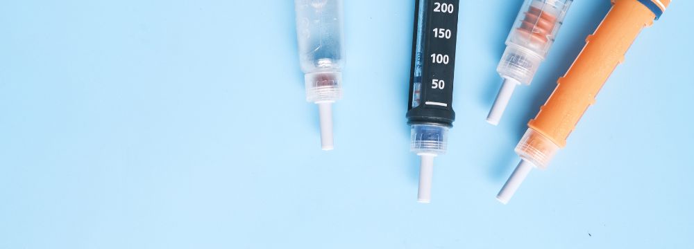 Diabetes injections lying across table