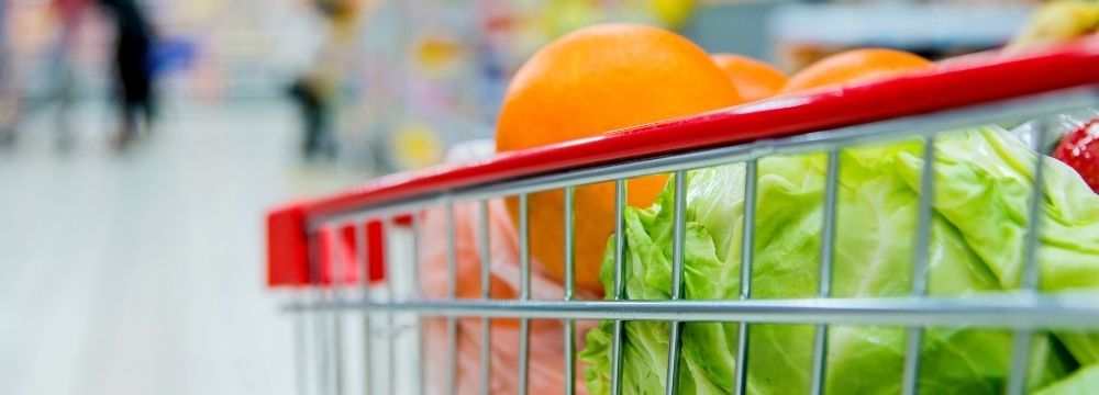 Grocery cart filled with fresh produce for healthy recipes after weight loss surgery as recommended by VIPSurg in Las Vegas